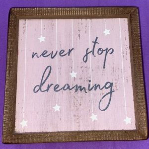 “never stop dreaming” wood sign